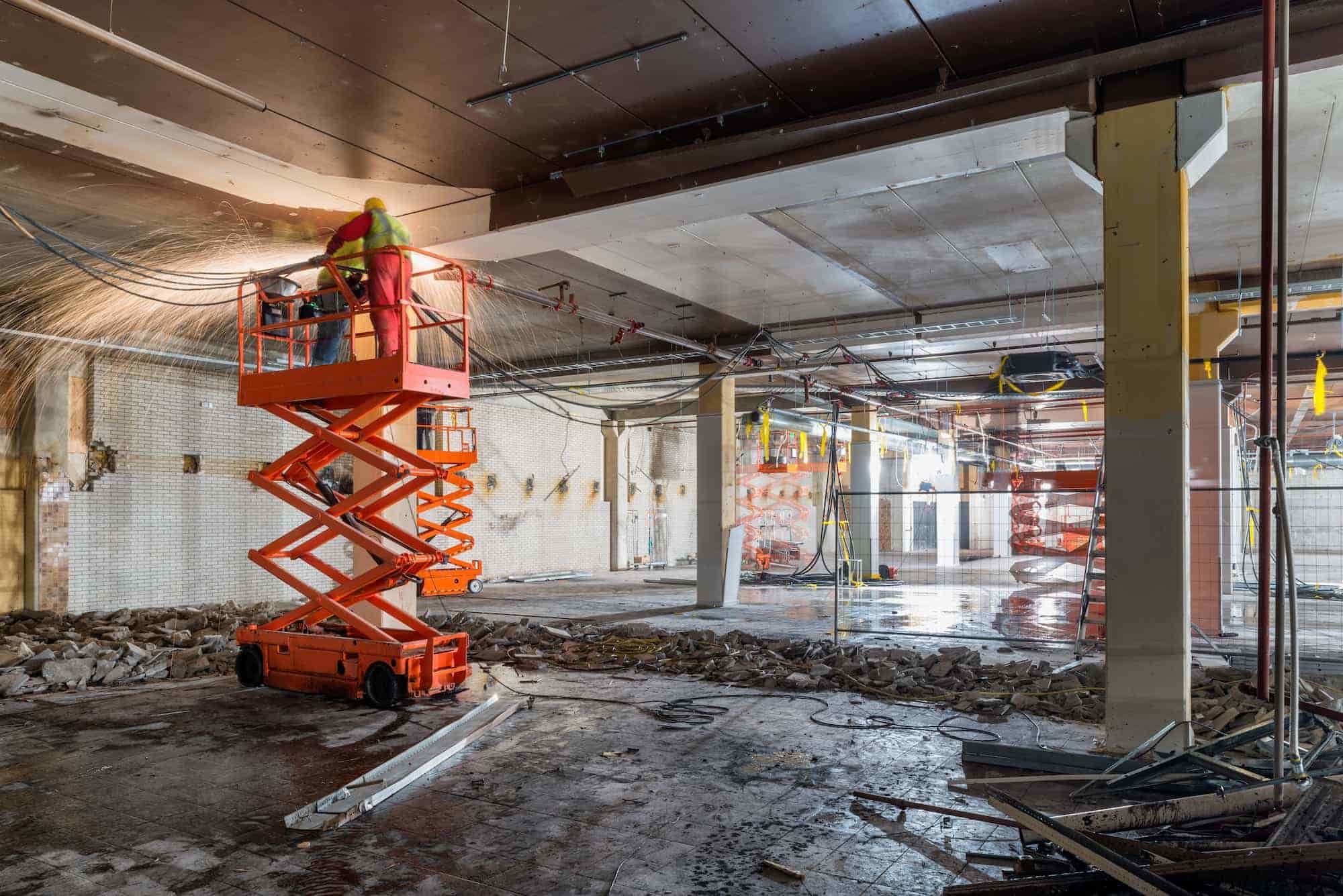 Orange Scissor Lift in Building